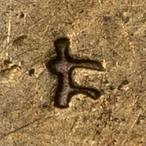 Possibly 仁 - rén - benevolence, humanity, kernel