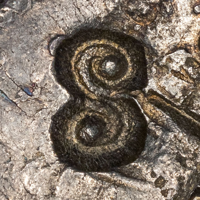 Symbol chopmark, similar to a curly 'S'