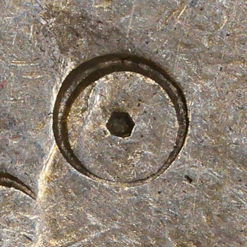 Possibly an ancient (Bronze inscription, Western Zhou period) form of 日 - *rì* - sun, day, date, day of the month