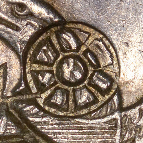 Symbol chopmark resembling a wagon wheel