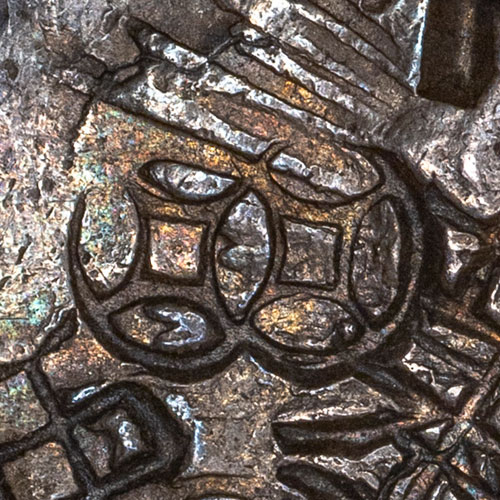Two linked cash coins, symbolic in Chinese culture for wealth, good fortune or luck