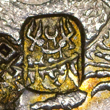 Possibly the seal script version of 恭 - gōng - respectful, reverent